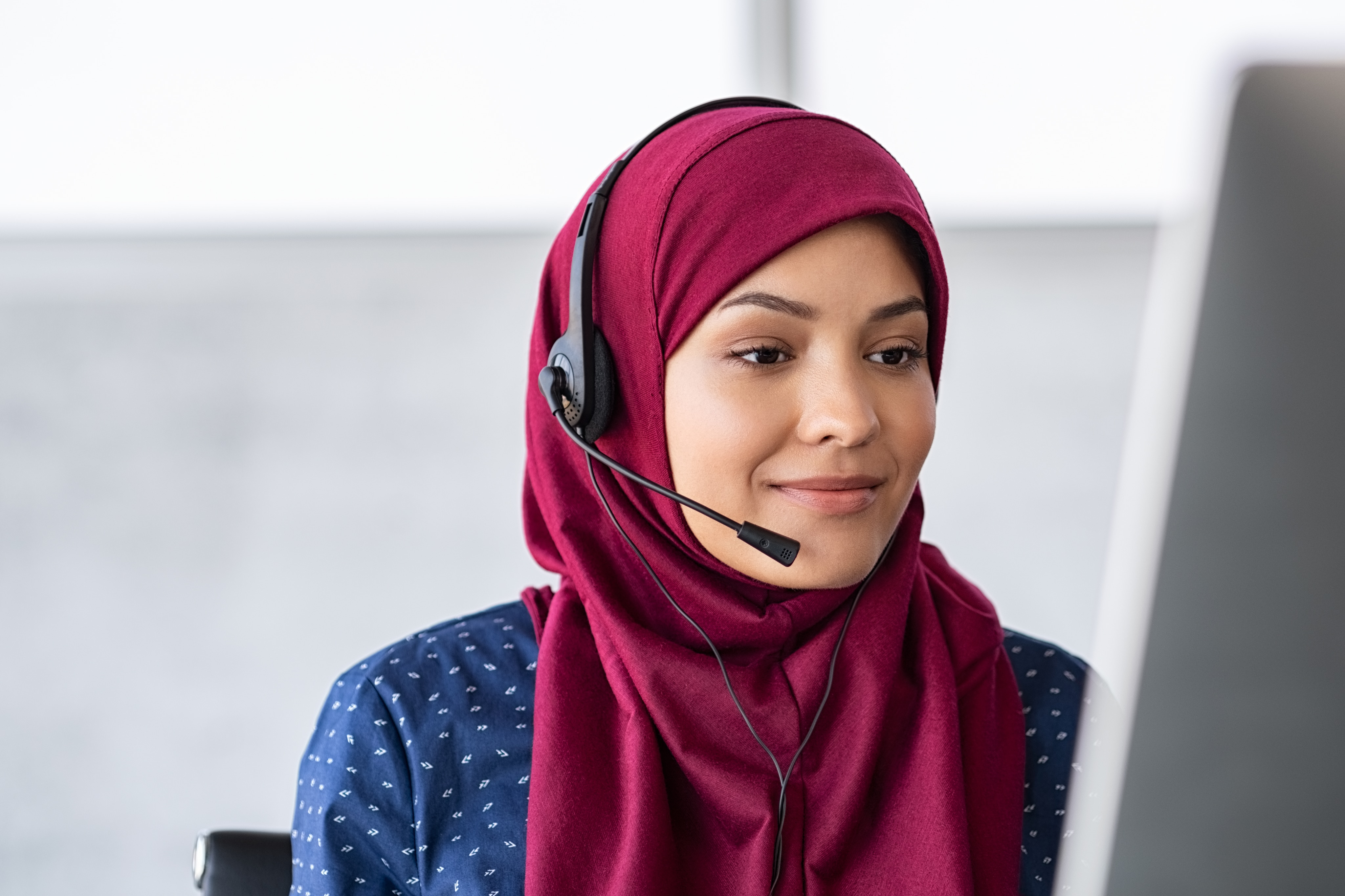 Mayo Clinic representative assisting an international patient by phone.